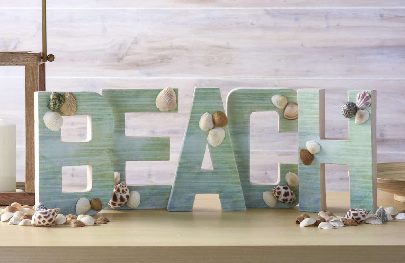 Make a fun project for summer! This DIY letter beach craft would look perfect on your mantel - and it