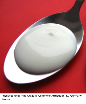 Yogurt on a spoon.